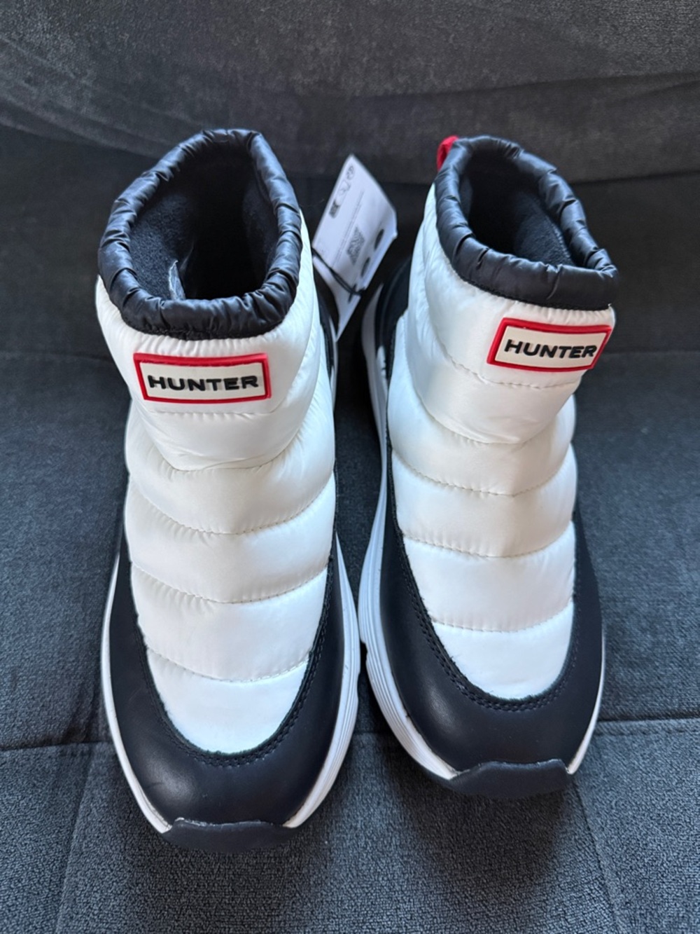 Hunter woman’s size 8 and Black Puffer Boot Sneakers with Red Logo new